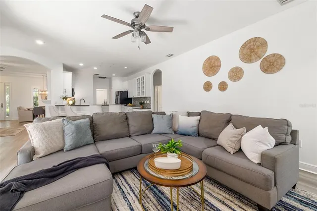 a kitchen with granite countertop white cabinets and appliances