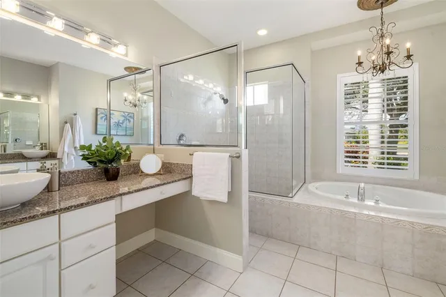 a spacious bedroom with a bed and furniture