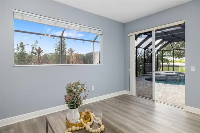 a backyard of a house with table and chairs