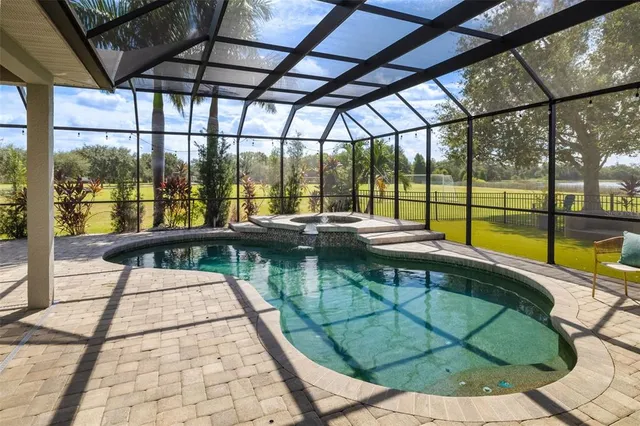 a view of a swimming pool with a lounge chair