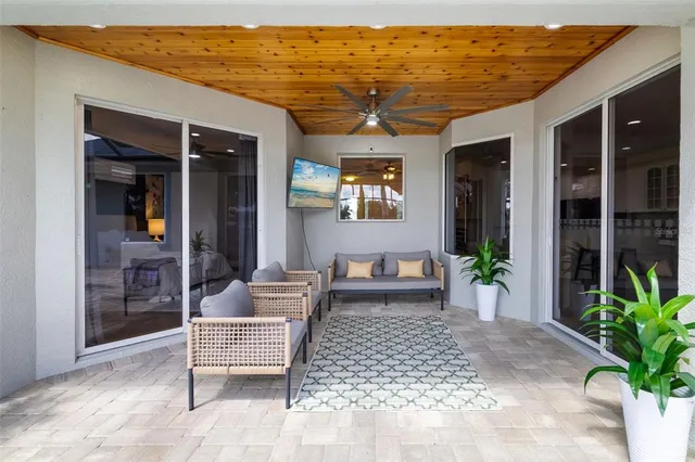 an aerial view of a house with a swimming pool and garden