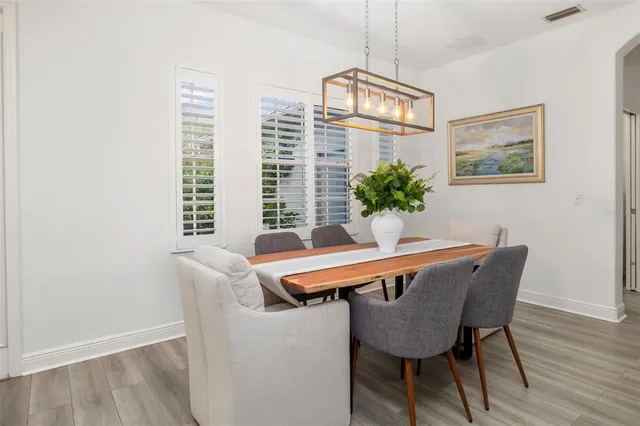 a living room with furniture and a lamp