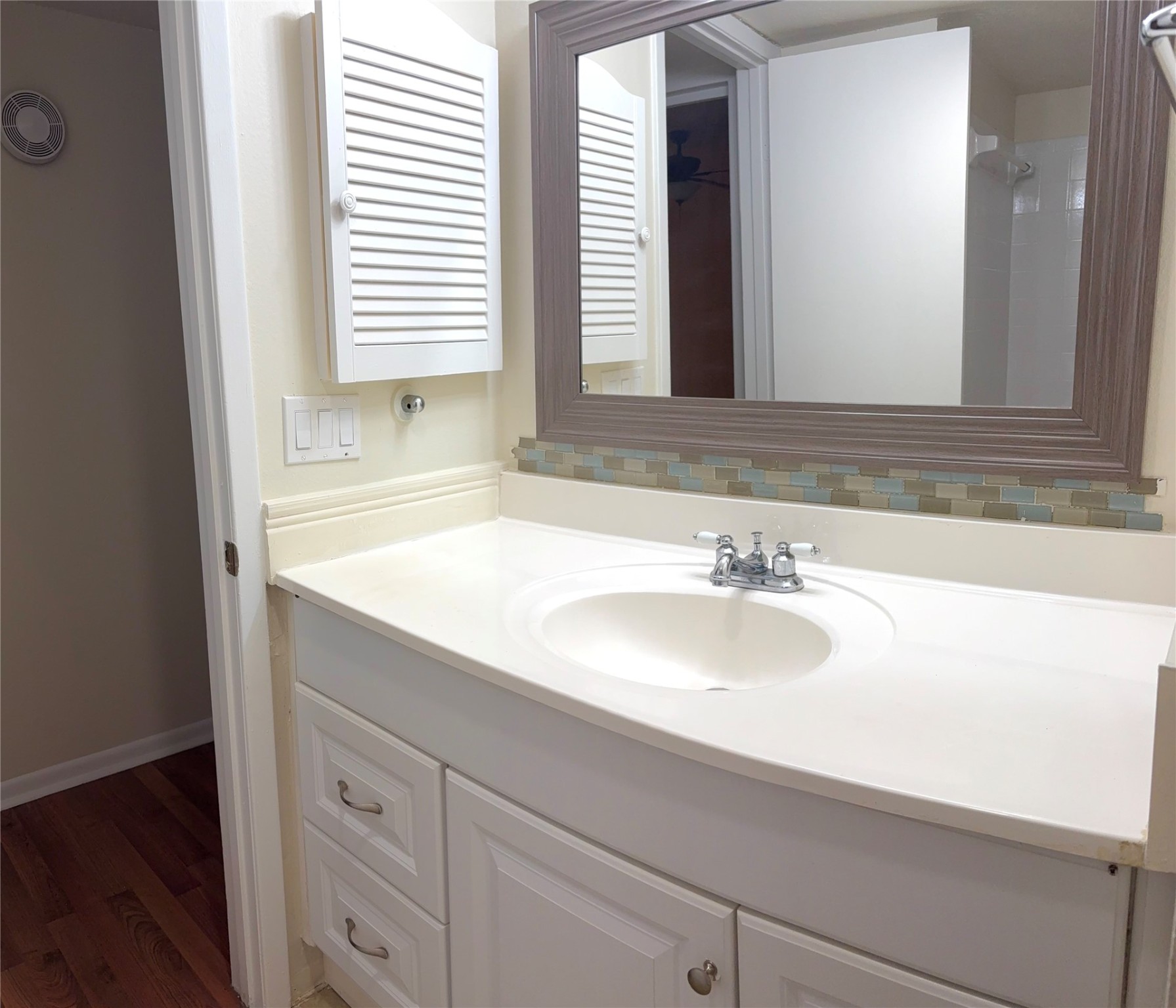 17331 Red Oak Drive, Unit 38 Houston, TX 77090 - Photo 15 of 19 a bathroom with a sink and a mirror