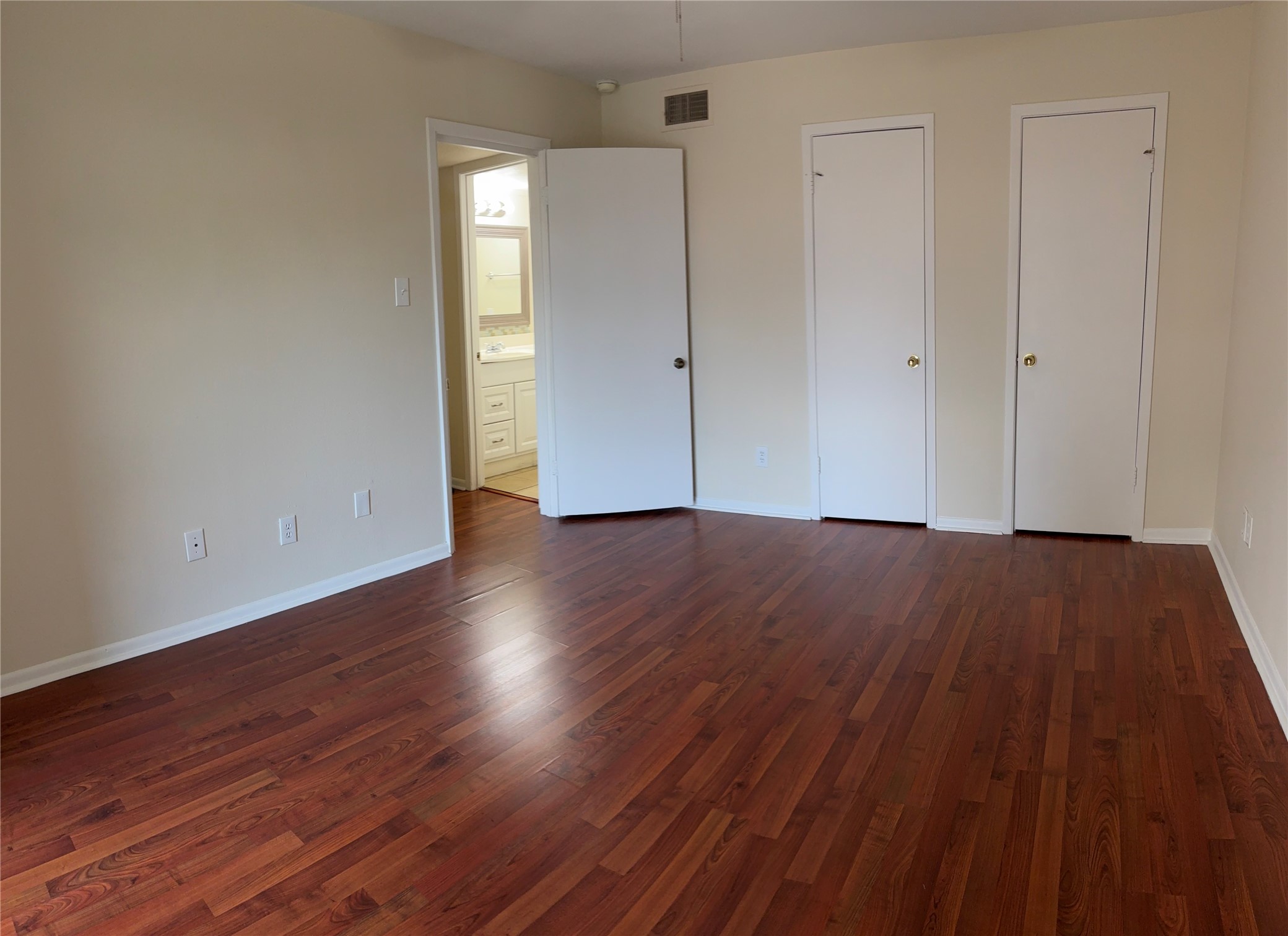 17331 Red Oak Drive, Unit 38 Houston, TX 77090 - Photo 17 of 19 a view of a room with wooden floor and white walls