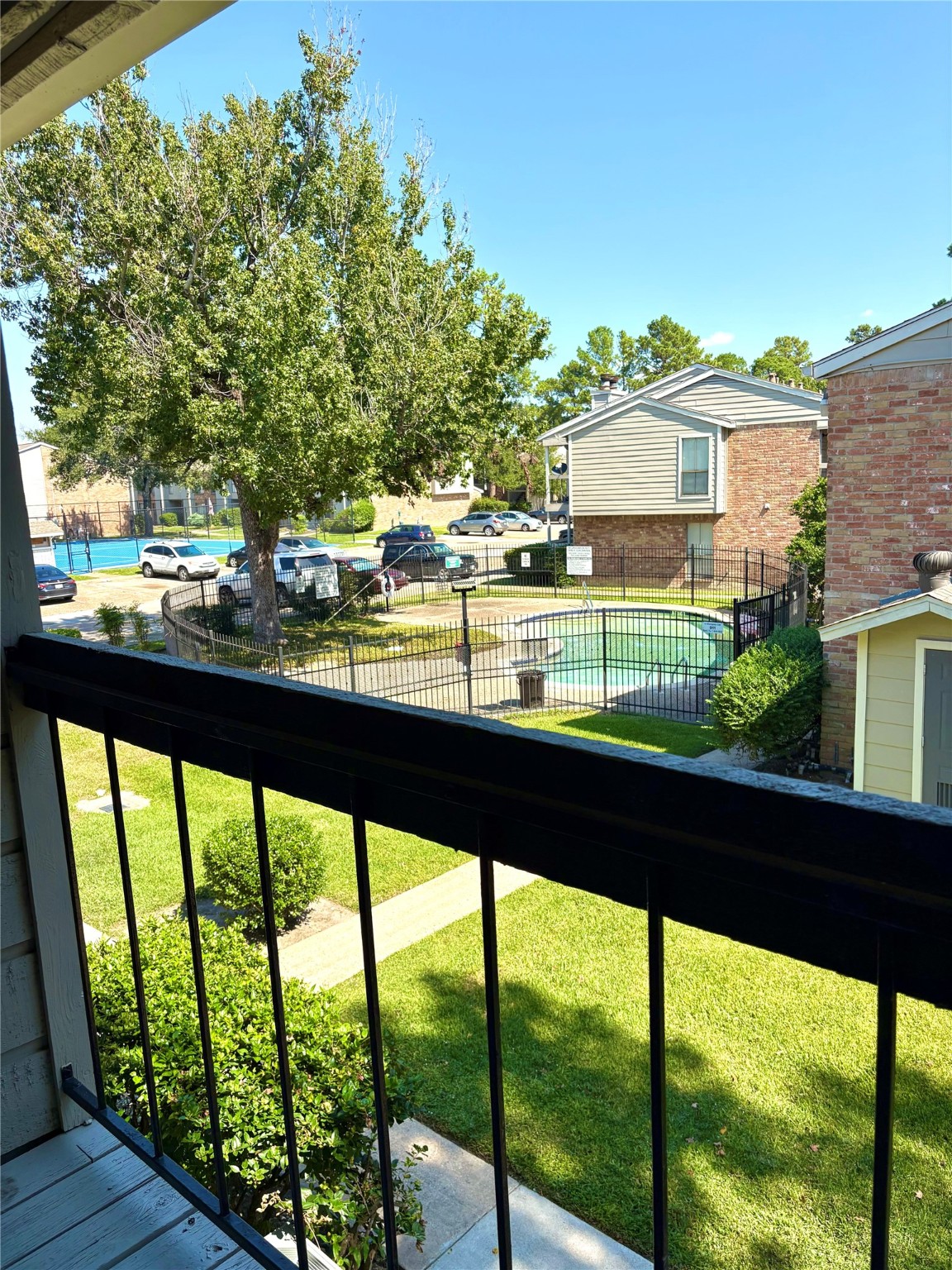 17331 Red Oak Drive, Unit 38 Houston, TX 77090 - Photo 5 of 19 a city view from a balcony