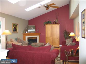 401 Augusta Drive East Reading, PA 19608 - Photo 3 of 10 a bedroom with a bed and a fireplace