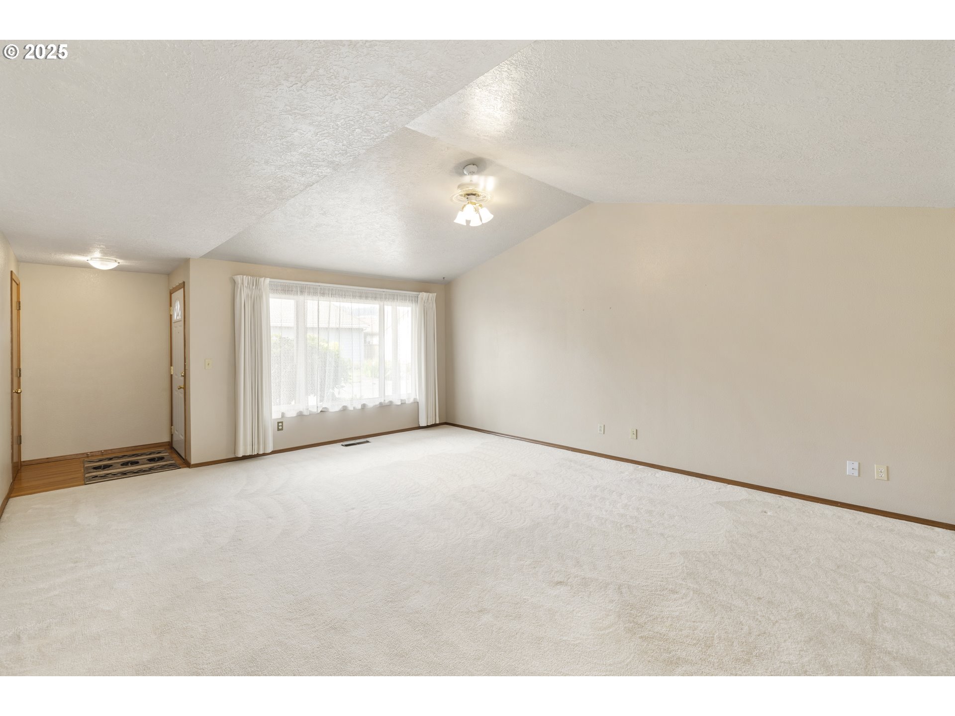 1609 Johnson Drive Newberg, OR 97132 - Photo 11 of 41 a view of an empty room with a window