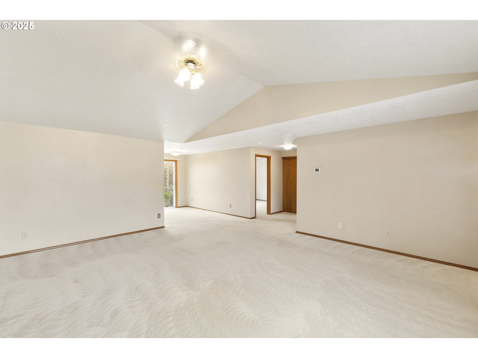 1609 Johnson Drive Newberg, OR 97132 - Photo 13 of 41 a view of an empty room with a chandelier fan