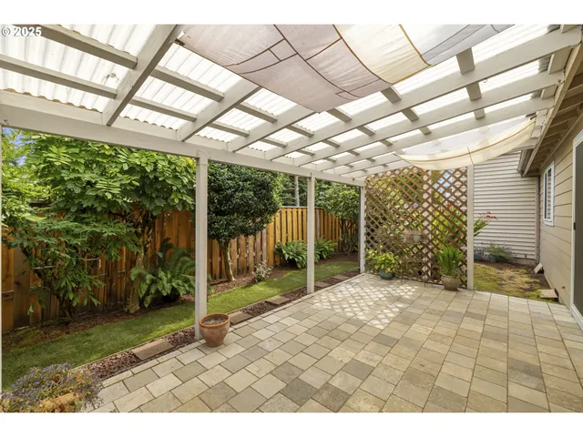 a kitchen with a stove a refrigerator and a sink