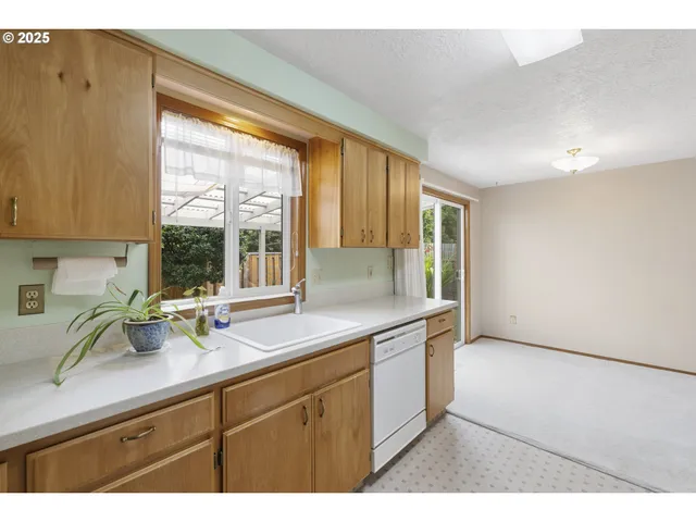 a kitchen with cabinets and appliances