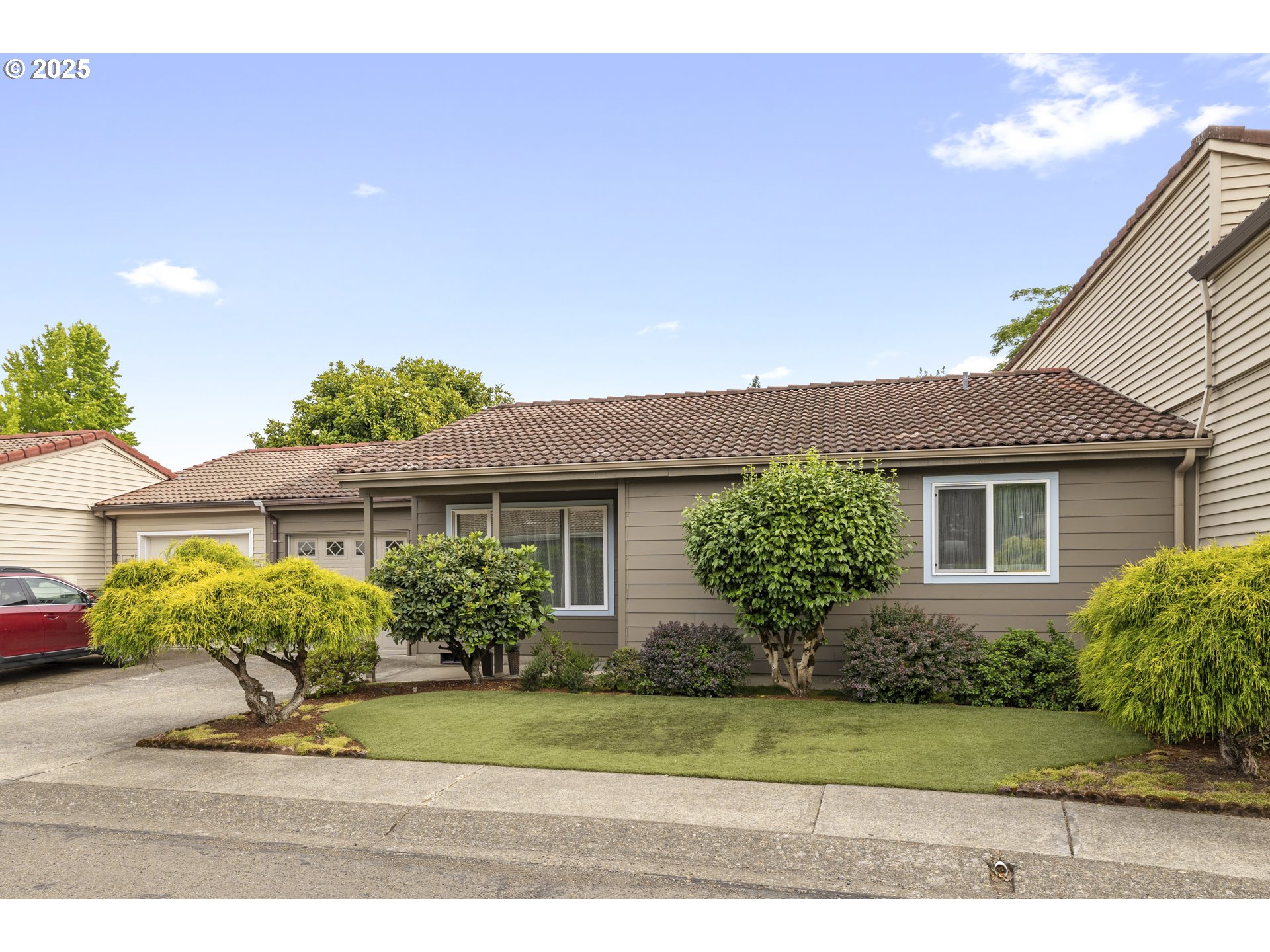 1609 Johnson Drive Newberg, OR 97132 - Photo 2 of 41 a front view of a house with garden