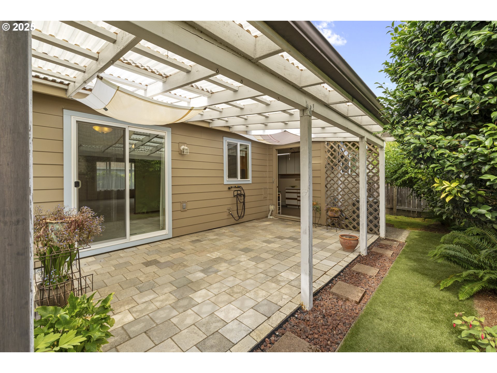 1609 Johnson Drive Newberg, OR 97132 - Photo 5 of 41 a view of a backyard with plants and large tree