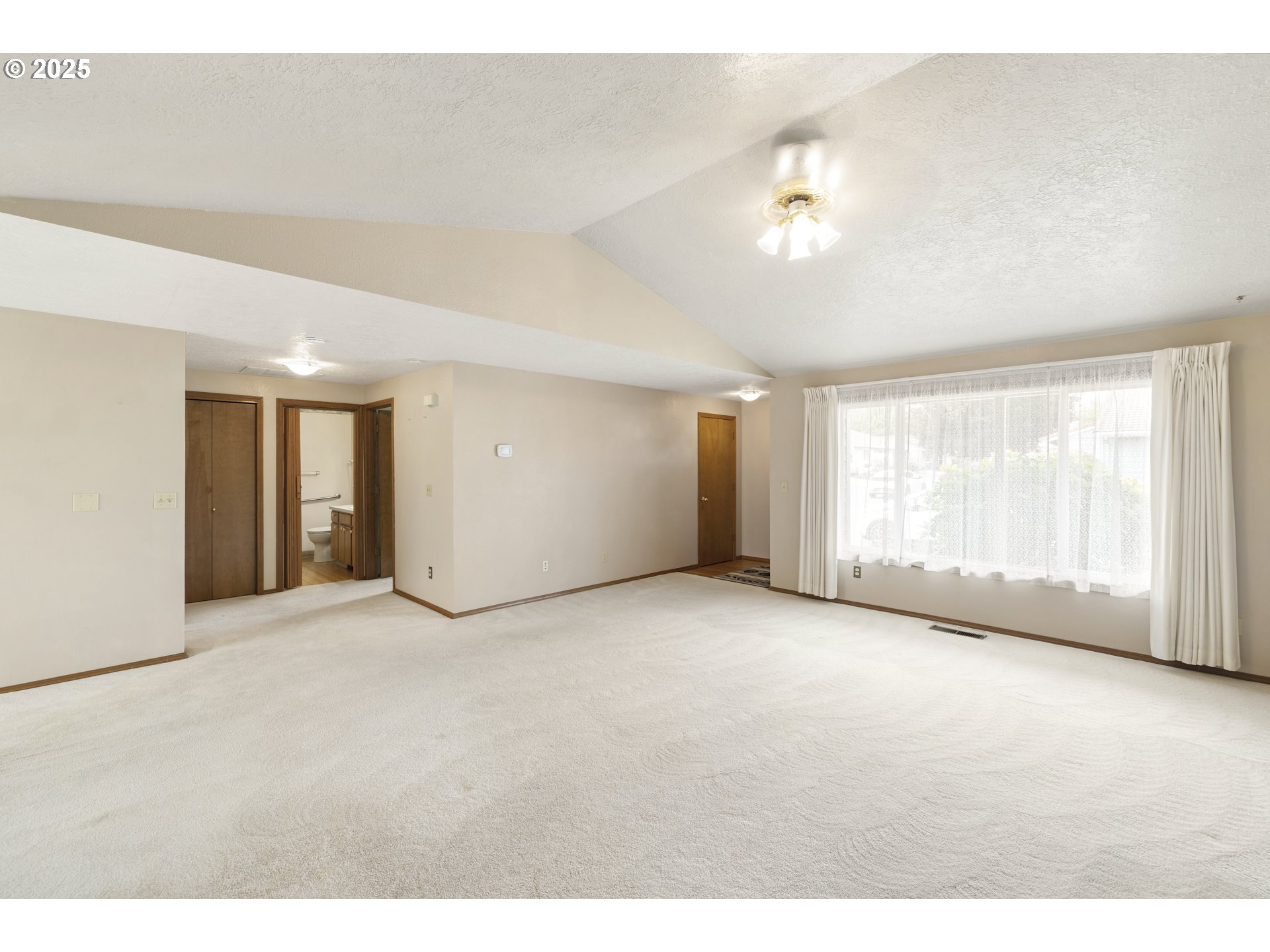 1609 Johnson Drive Newberg, OR 97132 - Photo 7 of 41 a view of an empty room with a window