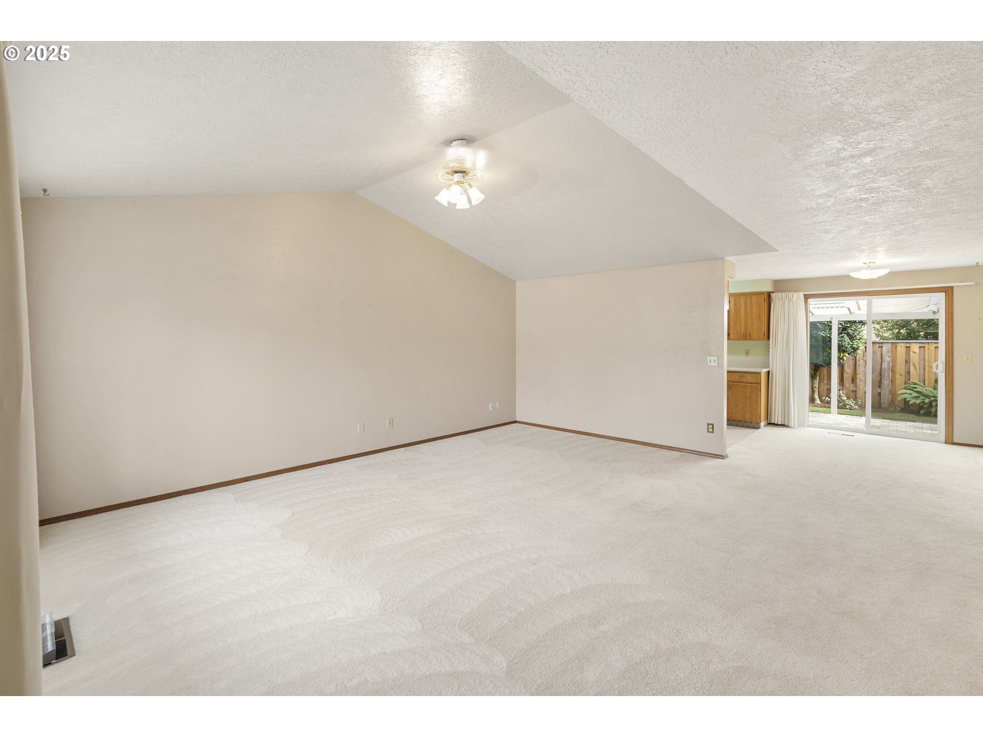 1609 Johnson Drive Newberg, OR 97132 - Photo 9 of 41 a view of an empty room with chandelier fan