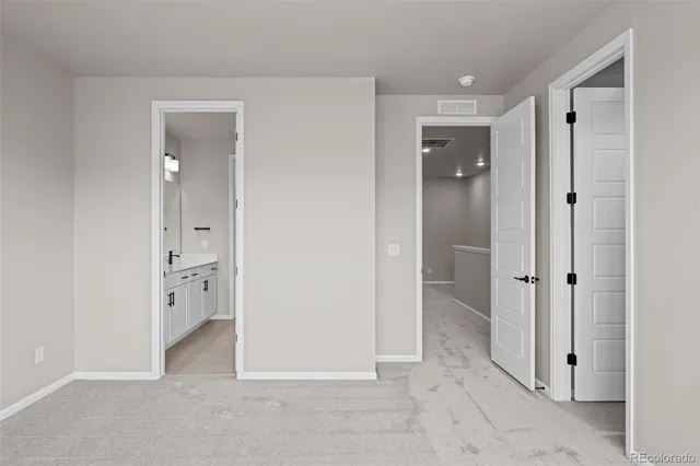 wooden floor with closet and windows
