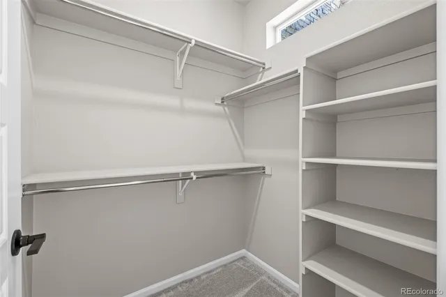 a view of an empty walk in closet