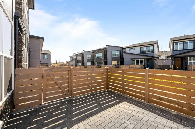 a view of a brick building next to a yard