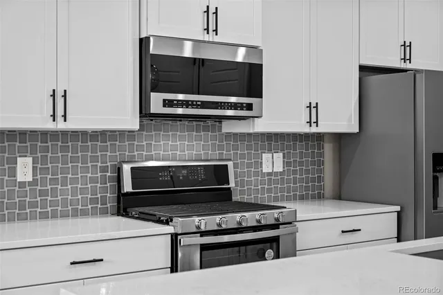 a kitchen with a stove and a microwave