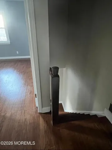 a room with a mirror and vanity