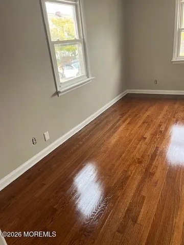 a view of a house with backyard and deck
