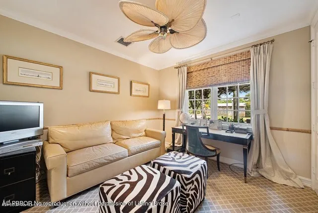 a kitchen with kitchen island a stove a sink a dining table and chairs