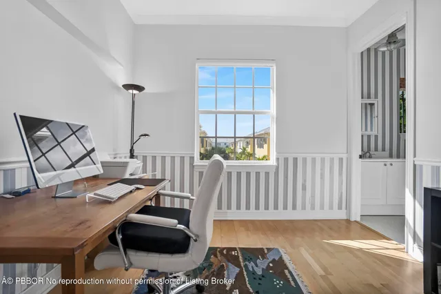 an aerial view of a city with lots of residential buildings and lake view