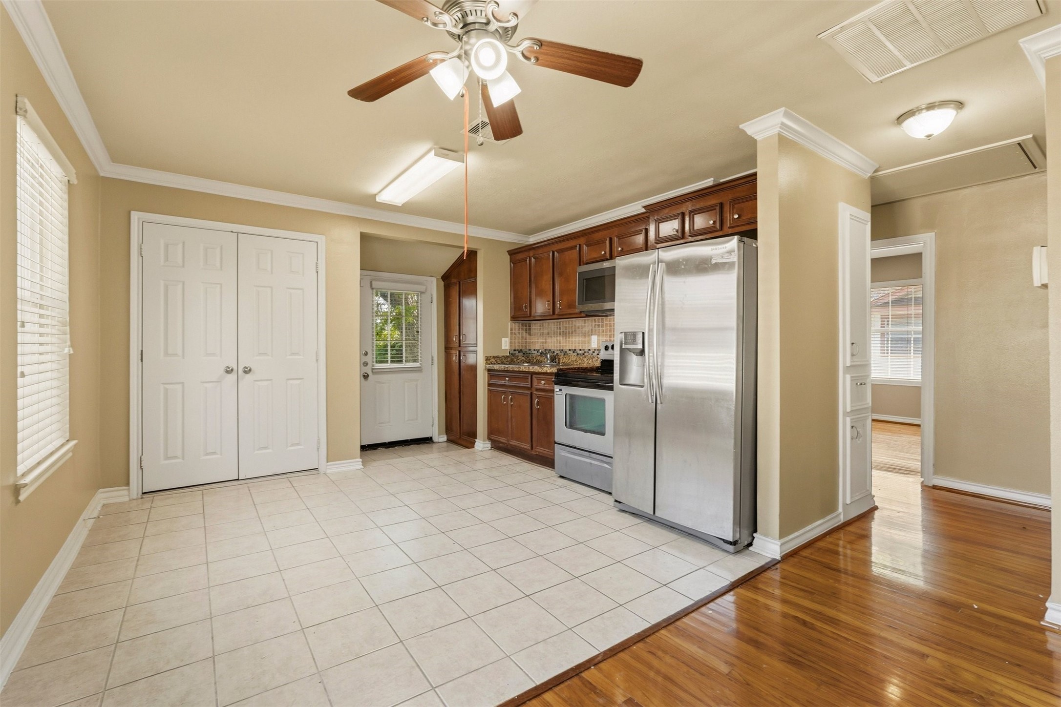 3445 Nathaniel Brown Street Houston, TX 77021 - Photo 9 of 19 a view of a kitchen with a sink and stainless steel appliances
