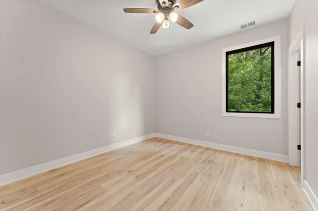 a bathroom with a bath tub and glass door