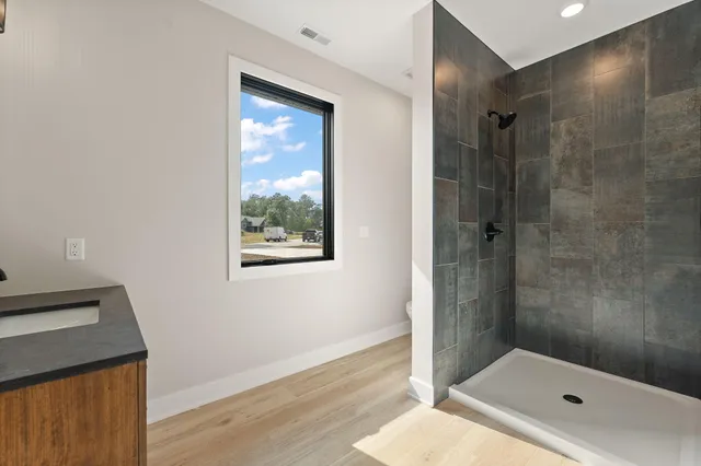 a bathroom with a tub and a shower