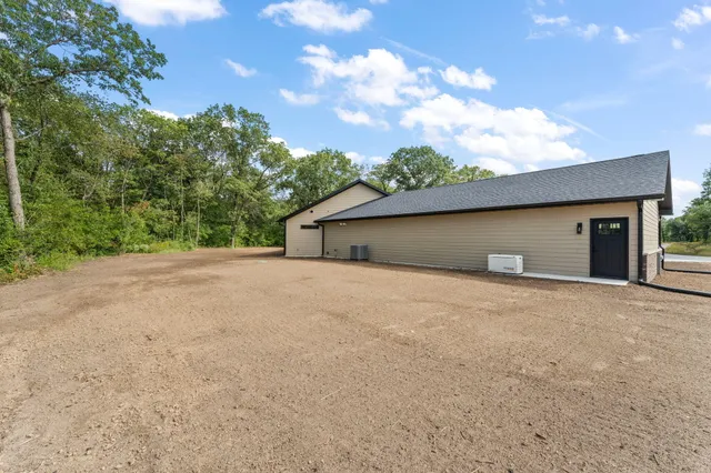 a view of a yard with a tree