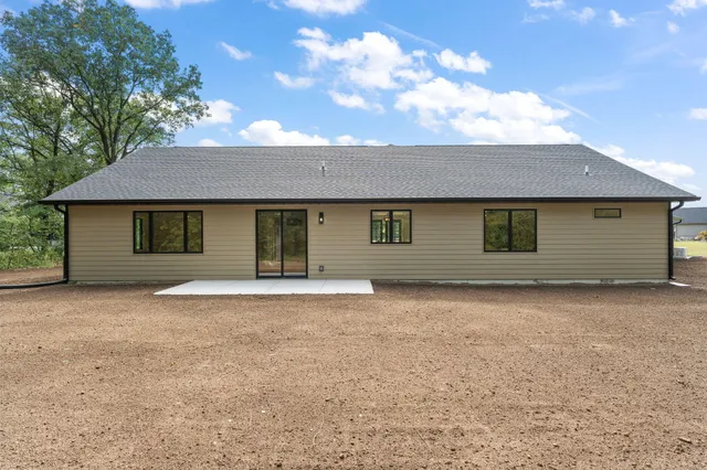 a spacious bathroom with a granite countertop sink