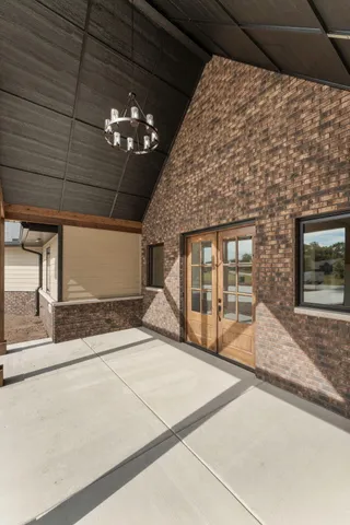 a front view of a house with a garden and yard