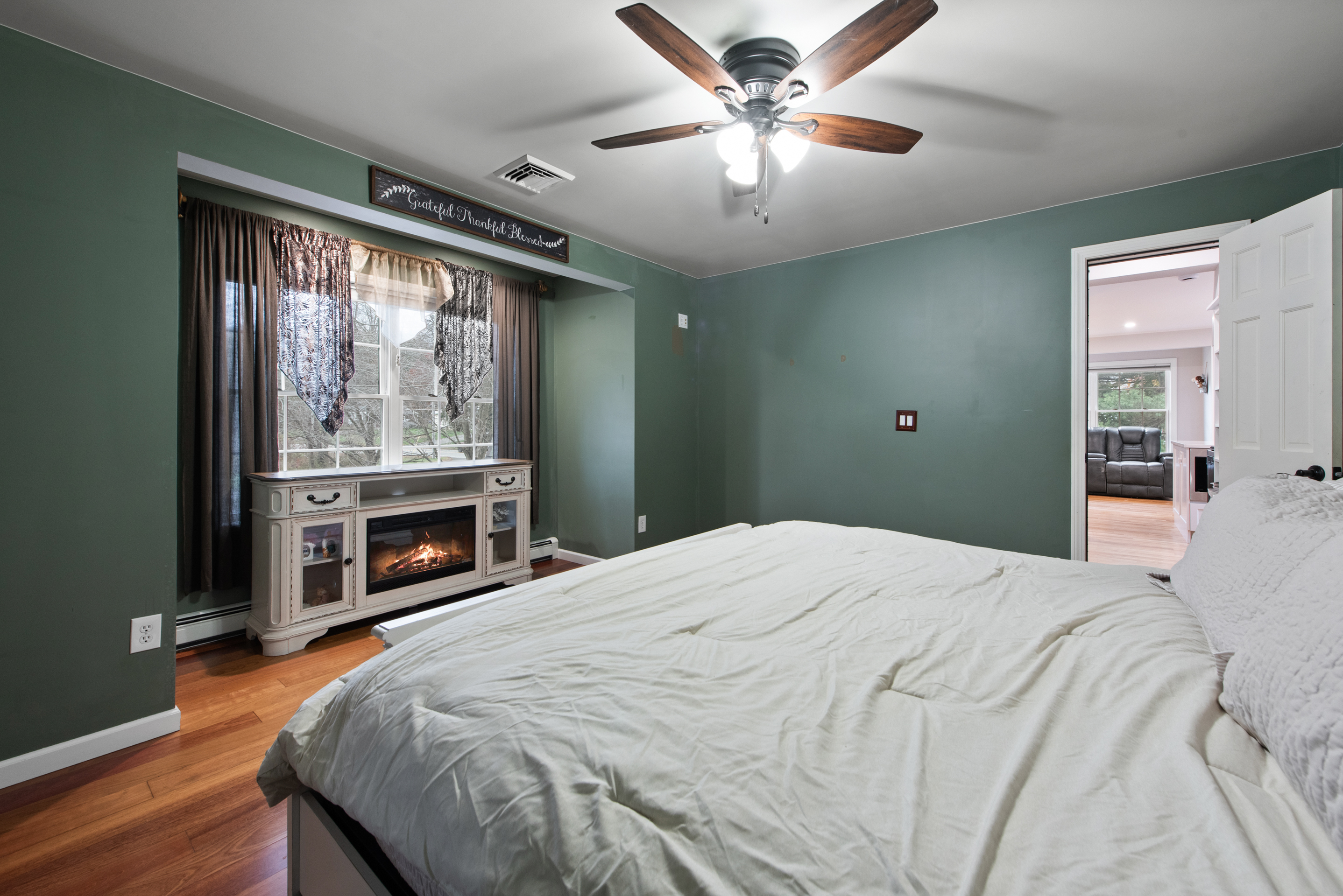 5 Race Track Hollow Middlefield, CT 06455 - Photo 18 of 40 a bedroom with a bed and a chandelier