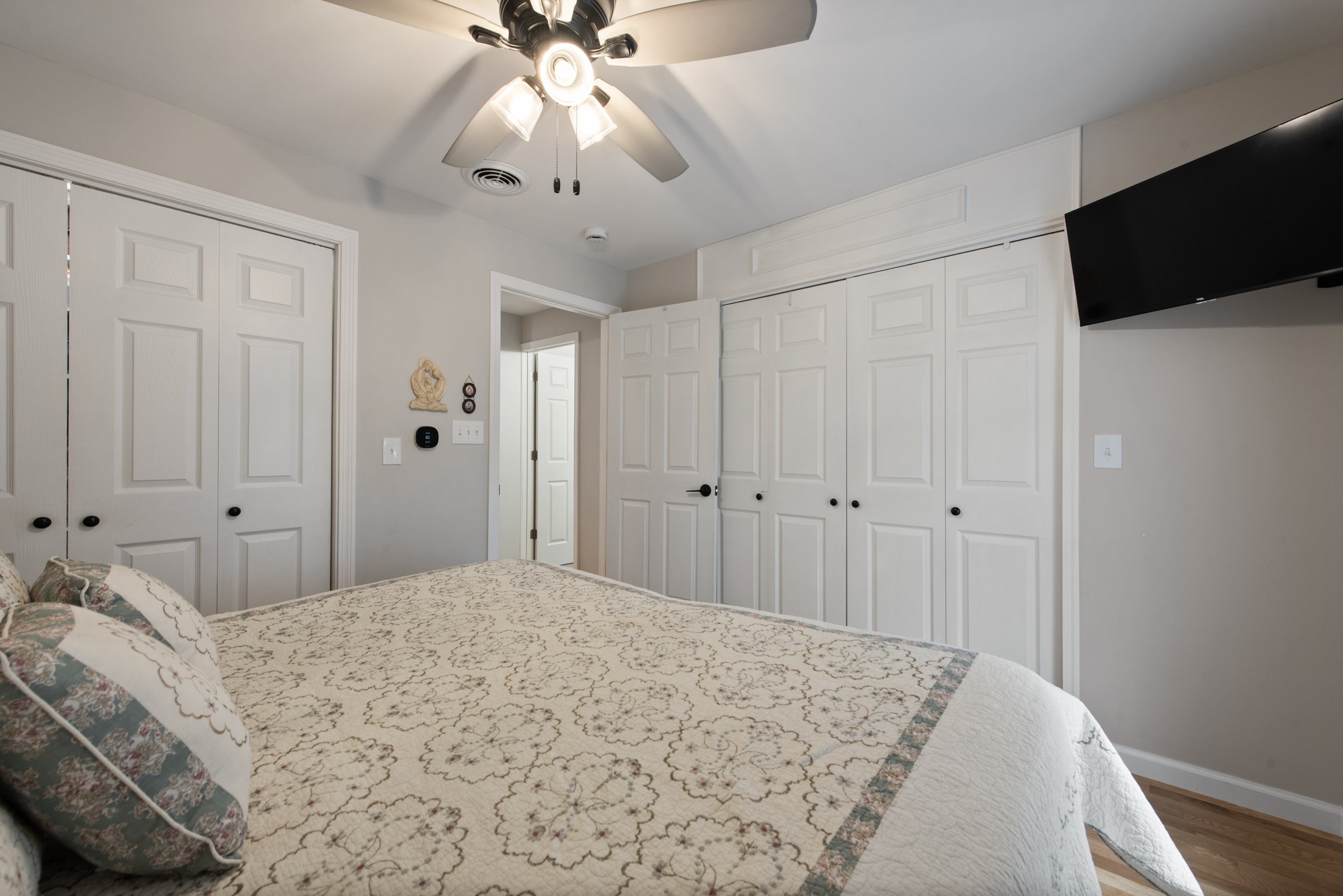 5 Race Track Hollow Middlefield, CT 06455 - Photo 25 of 40 a bedroom with a bed and a flat tv screen on dresser