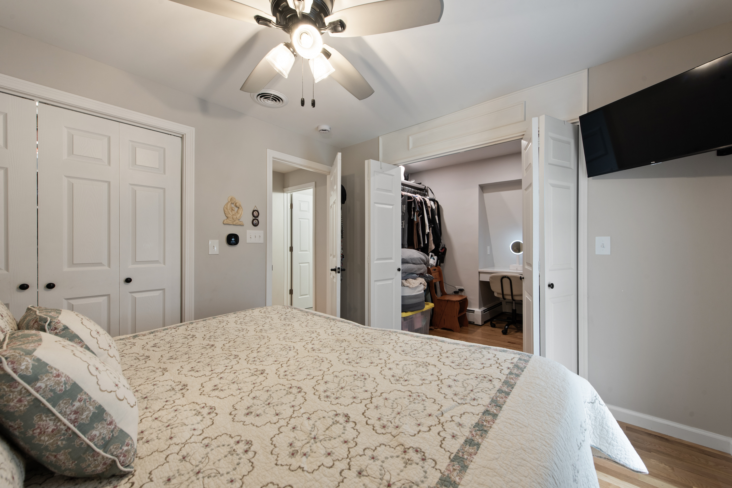 5 Race Track Hollow Middlefield, CT 06455 - Photo 26 of 40 a bedroom with a bed and a flat tv screen on dresser