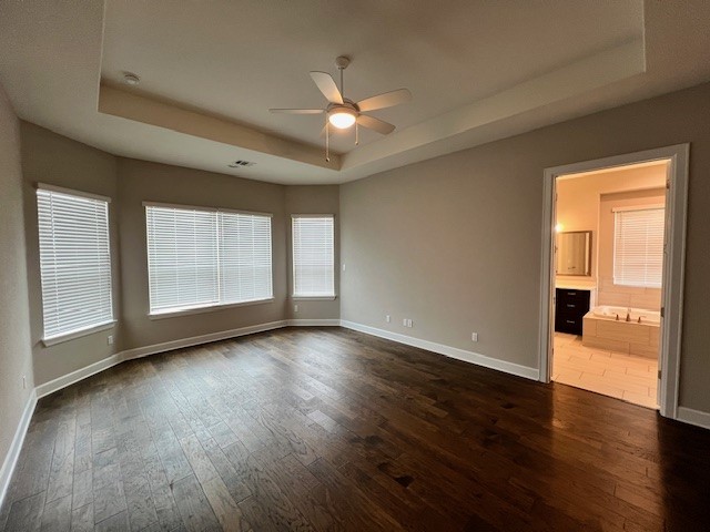 309 Buffalo Cave Road Georgetown, TX 78628 - Photo 11 of 22 a view of an empty room with wooden floor and a window