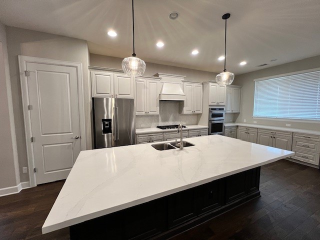 309 Buffalo Cave Road Georgetown, TX 78628 - Photo 7 of 22 a large kitchen with kitchen island a sink stainless steel appliances and cabinets