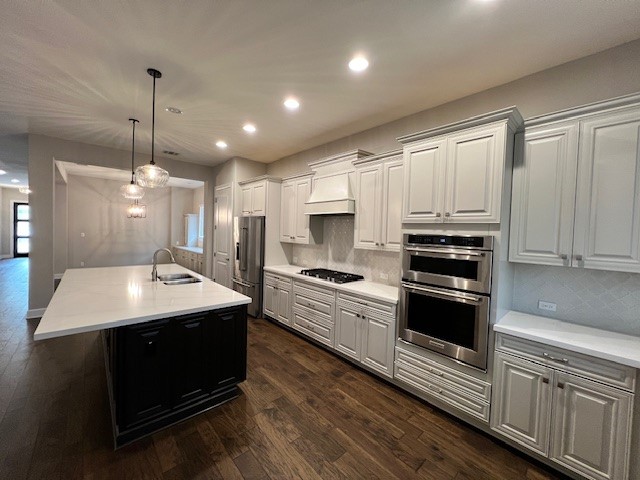 309 Buffalo Cave Road Georgetown, TX 78628 - Photo 10 of 22 a kitchen with stainless steel appliances kitchen island a sink dishwasher a stove and a refrigerator