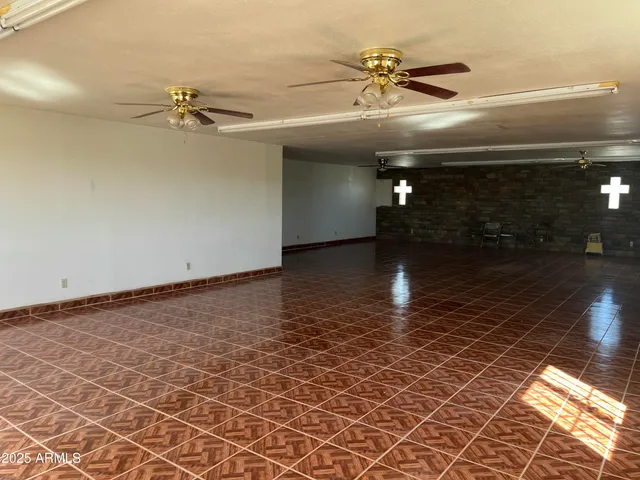 wooden floor in a hall with a window
