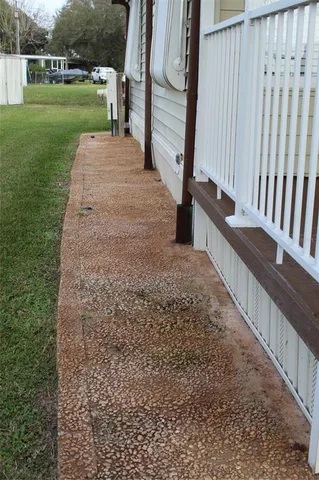 a green field covered with tall trees