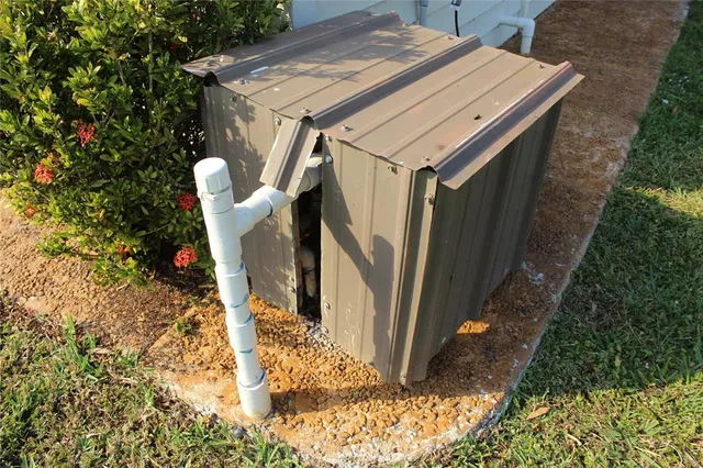 a kitchen with stainless steel appliances kitchen island granite countertop a refrigerator and a sink