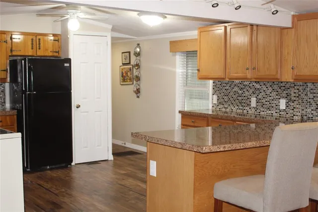a view of walk in closet with empty room
