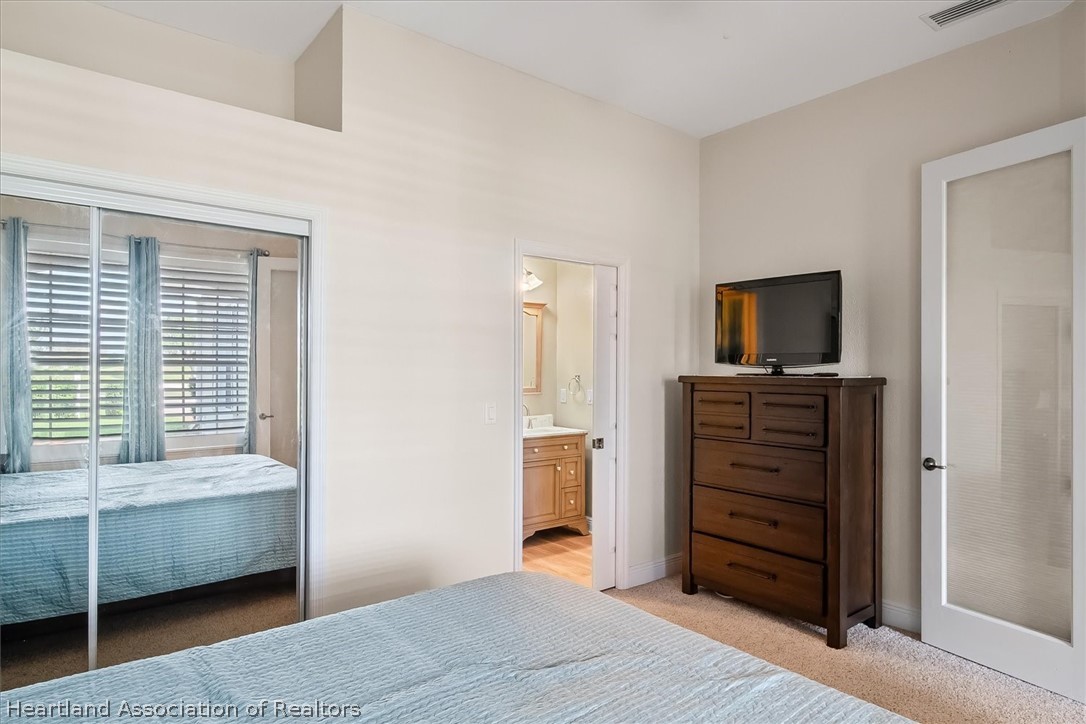 5224 Haw Branch Road Sebring, FL 33875 - Photo 27 of 40 a room with a dresser and a window