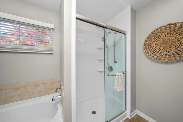 a bathroom with a glass shower door