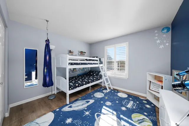 a bedroom with furniture and a window