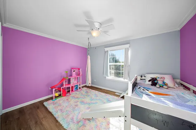 a bed room with a bed and a window