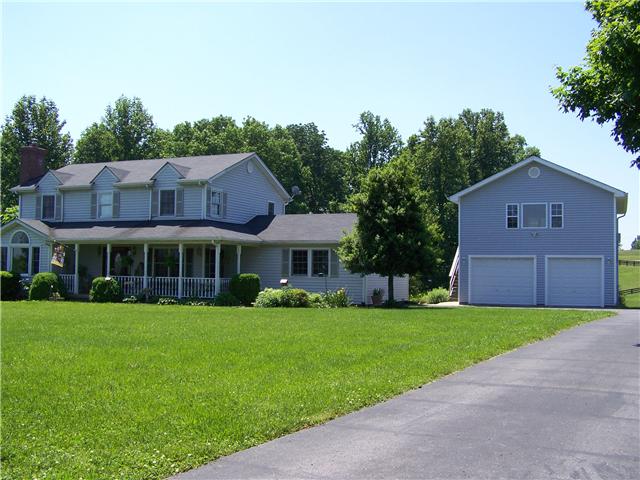 5902 Parham Road Franklin, TN 37064 - Photo 1 of 20 a front view of a house with a garden