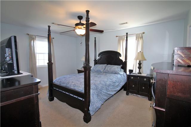 5902 Parham Road Franklin, TN 37064 - Photo 13 of 20 a bedroom with a bed and wooden floor