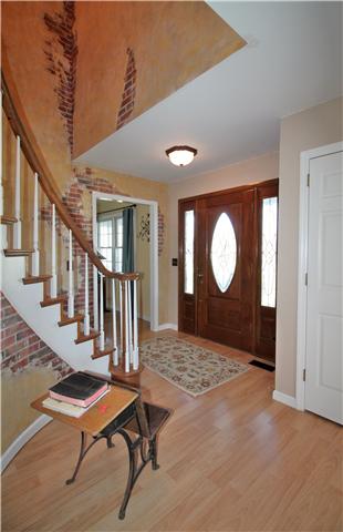 5902 Parham Road Franklin, TN 37064 - Photo 5 of 20 a view of a livingroom with wooden floor and chair