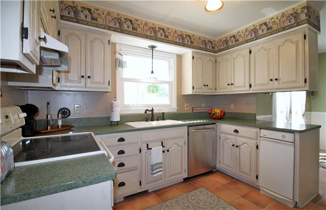 5902 Parham Road Franklin, TN 37064 - Photo 7 of 20 a kitchen with stainless steel appliances granite countertop a sink stove and cabinets